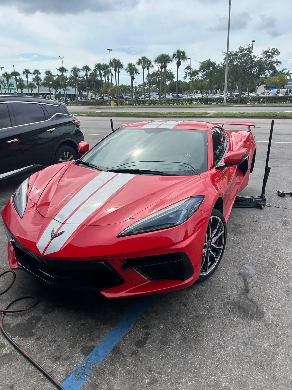 Mobile tire job on a Corvette C8, right in the parking lot