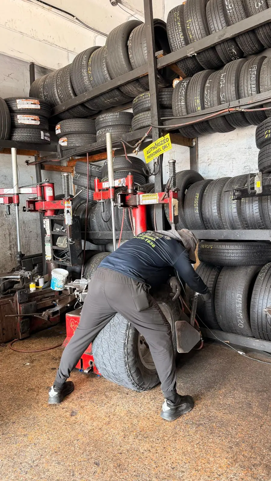 Floor-to-ceiling tire racks inside the shop