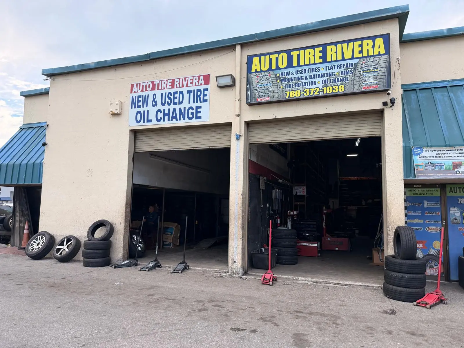 Auto Tire Rivera storefront on SW 107th Ave with both service bays open